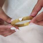 Gold Ribbed Bangle with Mother-of-Pearl Heart - Image 2