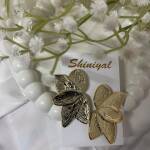 Half flower shaped anti tarnish earring.